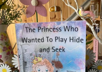 The princess who wanted to play hide and seek. surrounded by flowers and pretty things.