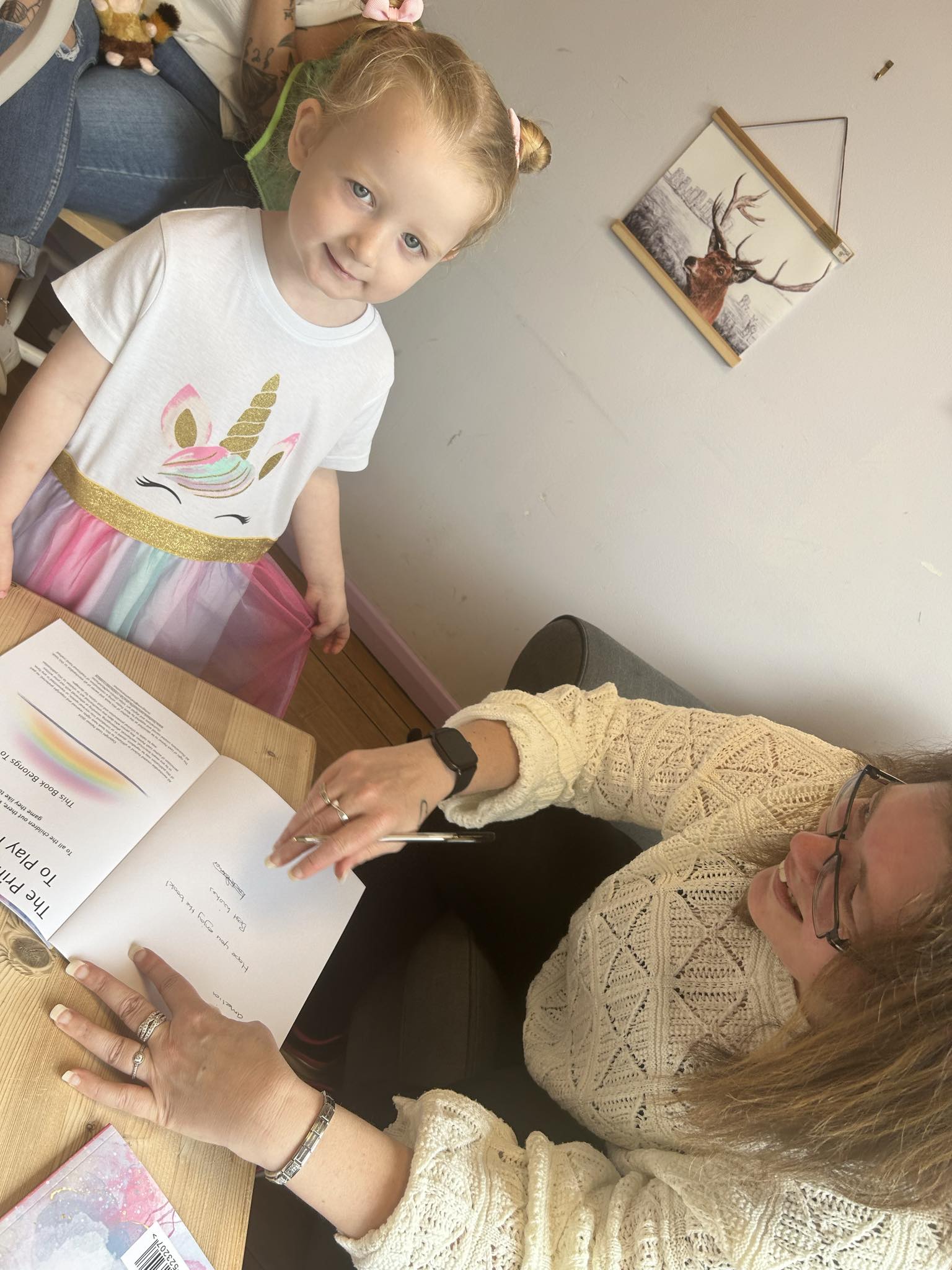 online-university-11 Leah signing a book for a very happy little girl